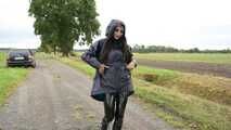 Miss Amira in blue Hunter rain jacket and patent leggings