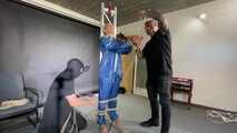 Ms ungeniert tied, gagged, suspended ind a shiny nylon Rainsuit and finally bullwhipped