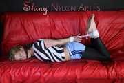 PiA being tied and gagged on a sofa with ropes and a clothgag wearing a sexy lightblue shiny nylon shorts and a white/black striped top Part 1 of 2 (Pics)