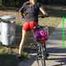 Watch Sandra riding her bike enjoying her red shiny nylon Shorts