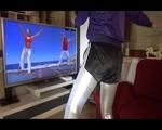 Mara wearing a black shiny nylon shorts a silver leggin and a purple rain jacket during her workout (Video)