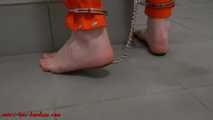 Female prisoner cuffed and shackled