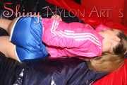 Watching sexy ARCHIVE GIRL wearing a sexy blue shiny nylon shorts and a pink rain jacket posing and lolling on bed for you (Pics)