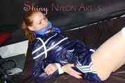 ***RONJA*** being tied and gagged on a sofa with ropes and a clothgag wearing a sexy blue shiny nylon shorts and a rainjacket (Pics)