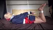 ***HOT HOT HOT*** PIA tied and gagged on a bed with ropes on the ceiling wearing sexy blue/red shiny nylon shorts and a white shirt (Video)