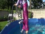 Watch Sandra enjoying her shiny nylon Downwear at a warm Summer Day in the Garden and in the Pool