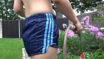 Watching Ayiana wearing  only a sexy blue shiny nylon shorts watering the flowers (Video)