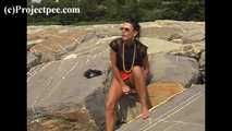 016169 Eve Takes A Discrete Pee On The Rocks