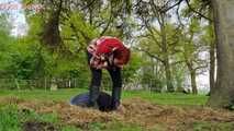 Rubber boot mistress presses slave face into manure