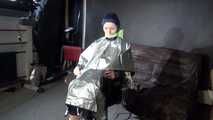 See Ronja tied and gagged on a Barber Chair in shiny nylon Rainwear and a shiny cape!