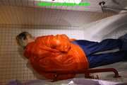 SEXY SONJA wearing a black shiny nylon rain pants and an orange big downjacket enjoying a bath (Pics)