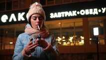 Lovely Russian girl Karina smokes a cigarette in the cold outside 