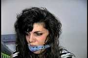 35 YEAR OLD ITALIAN HAIRDRESSER IS CLEAVE GAGGED, MOUTH STUFFED WITH PANTIES, HANDGAGGED, WHILE TIGHTLY TIED TO A CHAIR (D74-14)