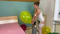 helium overinflating six balloons in white lingerie