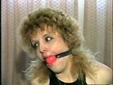 BEAUTIFUL DOE EYED REBECCA IS BALL-GAGGED, MOUTH STUFFED, TAPE GAGGED & BLINDFOLDED (D33-4)
