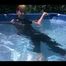 Mara sunbathing and swimming in the pool wearing a supersexy black adidas shiny nylon catsuit (Video)