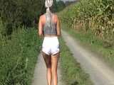 Watch Chloe taking a walk with her shiny nylon Shorts