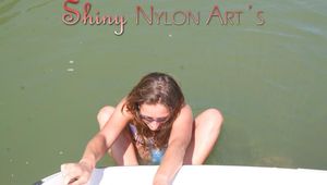 Leonie and Stella during sunbathing on a landing stage wearing sexy shiny nylon shorts and tops (Pics)