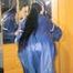 Lucy wearing sexy blue shiny nylon rainwear cleaning the mirror (Pics)