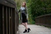 Miss Petra in a hot vinyl skirt, high heels and transparent blouse at photo shooting