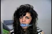 35 YEAR OLD ITALIAN HAIRDRESSER IS CLEAVE GAGGED, MOUTH STUFFED WITH PANTIES, HANDGAGGED, WHILE TIGHTLY TIED TO A CHAIR (D74-14)