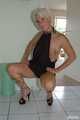Blonde mature Claudia stipping out of a black dress