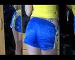 ***NEW MODEL*** Sandra wearing highheels and a sexy blue/yellow shiny nylon shorts and a yellow top during cleaning the mirror (Video)