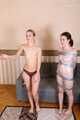 Bekki and Kelly - Sisters are taped and wrapped together face to face