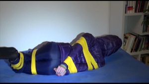 Pia tied, gagged and hooded with tape wearing a blue rain pants and a purple downjacket of Esprit (Video)