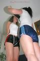One archive girl tied and gagged by another archive girl wearing shiny nylon shorts (Pics)