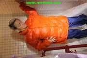 SEXY SONJA wearing a black shiny nylon rain pants and an orange big downjacket enjoying a bath (Pics)