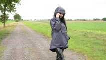 Miss Amira in blue Hunter rain jacket and patent leggings