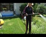 Pia wearing a sexy black/pink adidas sweat suit while watering the flowers in the garden (Video)