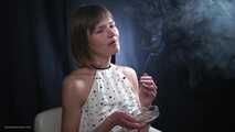 34 years old lady is smoking cork 100mm cigarette