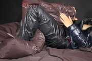 Watching Sandra wearing a sexy shiny nylon down pants and a sexy down jacket with coat lolling and posing for you on a sofa (Pics)
