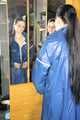 Lucy wearing sexy blue shiny nylon rainwear cleaning the mirror (Pics)