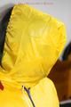 Jill tied and gagged on a chair wearing a yellow rainsuit and coveres with an yellow raincoat with two hoods (Pics)