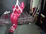 Watch Sandra beeing bound gagged and pantyhooded in her shiny nylon Rainwear