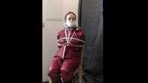 Lady Nadja getting bound and gagged by a raincoated stranger