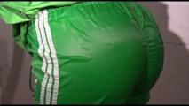 Sonja tied and gagged in a shower with tape and rope wearing a supersexy green shiny nylon shorts and rain jacket (Video)