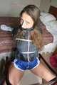 Stella being tied and gagged with ropes and a clothgag on a chair wearing a sexy shiny nylon short and a rain jacket (Pics)