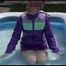 Watching Mara wearing a sexy short down skirt and a down jacket playing with water in the swimming pool (Video)