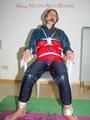 Katharina tied and gagged on a chair wearing shiny nylon rainwear and a raincape (Pics)