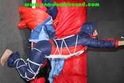 Sonja tied and gagged overhead with ropes and a ballgag wearing a sexy shiny nylon oldschool downbib (Pics)