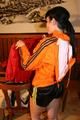 Jill wearing a sexy black nylon shorts and a orange rain jacket while dressing her up (Pics)