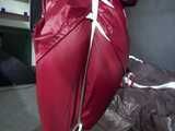 Watch Sandra beeing bound gagged and pantyhooded in her shiny nylon Rainwear