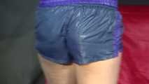 Watching sexy Pia wearing a supersexy shiny nylon shorts and rain jacket cleaning the studio (Video)