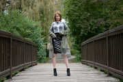 Miss Petra in a hot vinyl skirt, high heels and transparent blouse at photo shooting