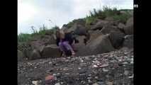 007001 Kim Takes Her First Pee Of The Day On The Rocky Beach