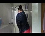 Jill wearing a sexy red shiny nylon shorts and a black rain jacket while taking a shower and play with babyoil (Video)